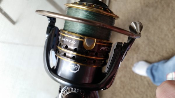 Spinning reel bail closes during cast